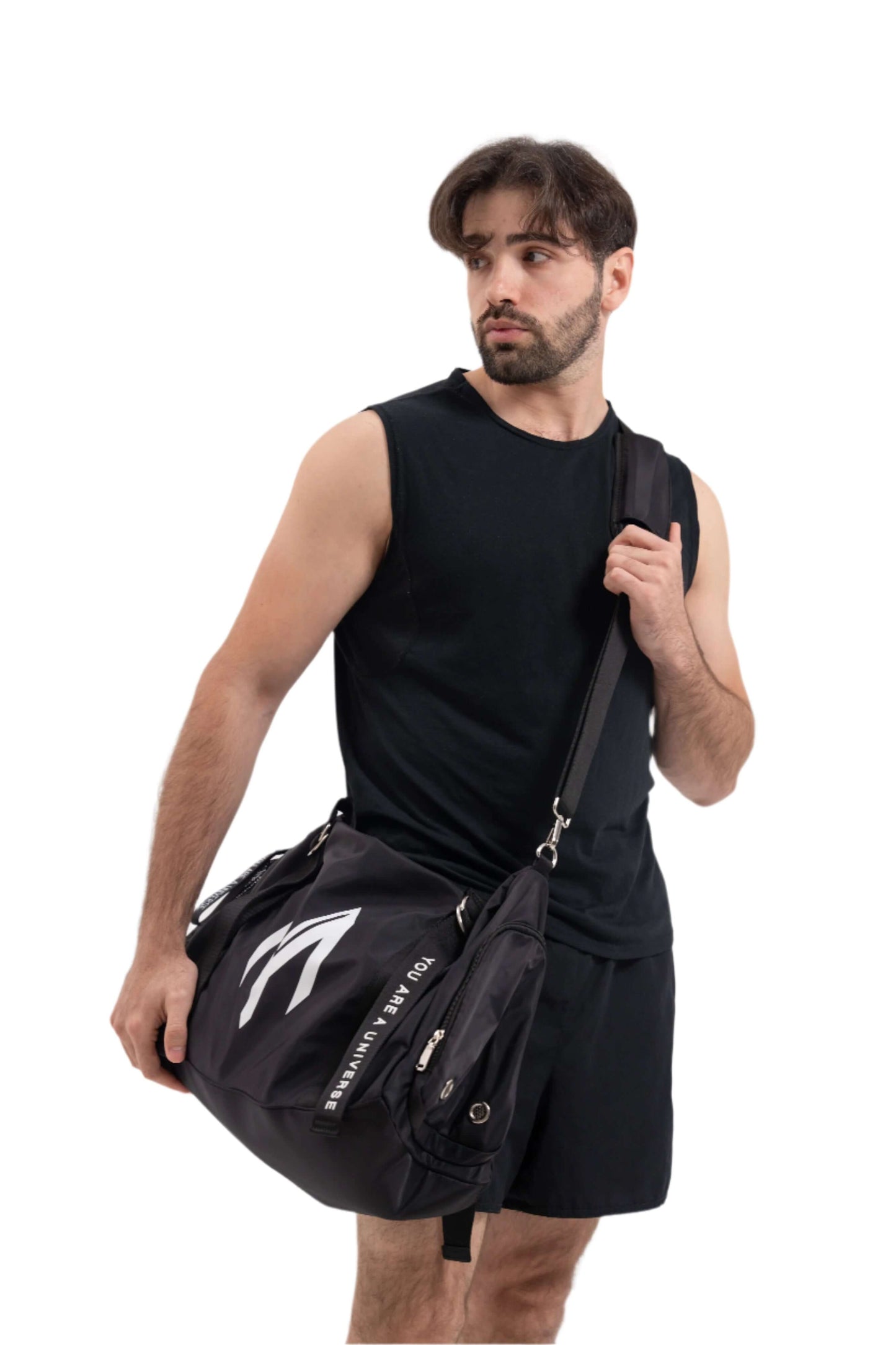 Man holding a black duffel bag with a white logo on a white background