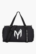 Front view of the black Myticos gym bag with a large M logo, adjustable straps, and durable fabric.